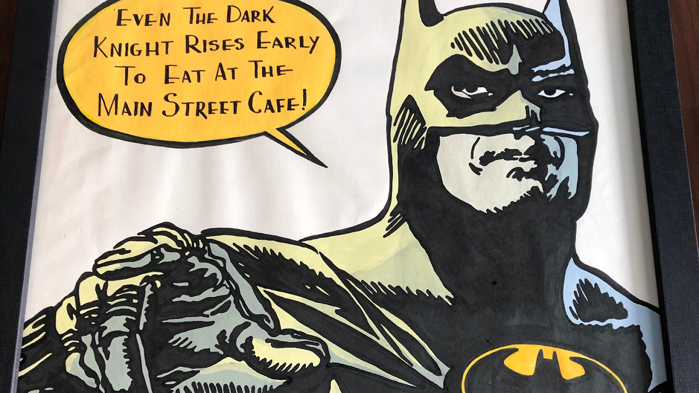 Batman poster at the cafe